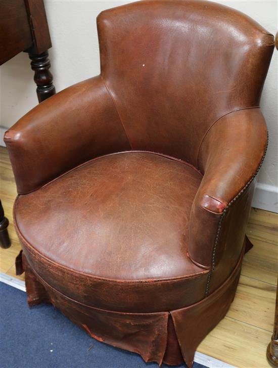 A pair of leather tub club chairs